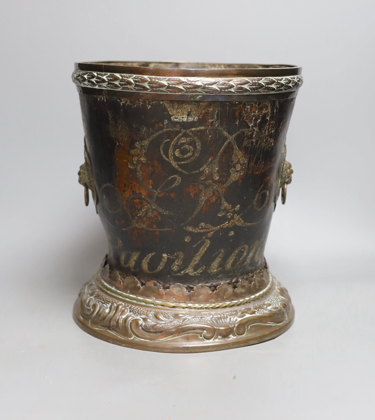 A George III leather fire bucket dated 1800, with later 19th century mounts, inscribed 'GR 1800 Pavilion' (cut down), 27cm tall